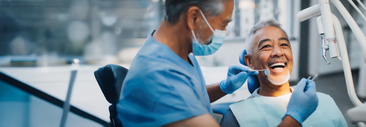 Dentist with patient working part-time dentistry jobs.